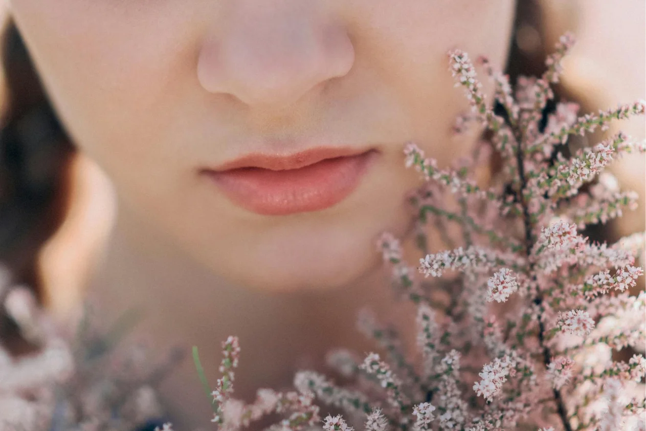 The lips of a woman with flowers