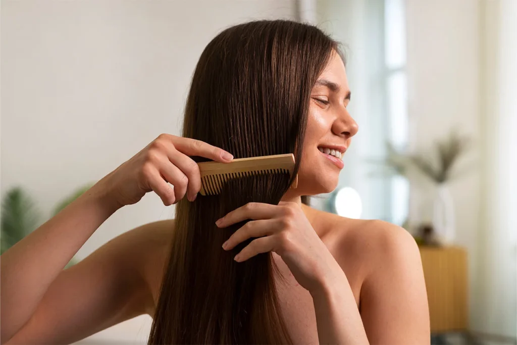 A woman combing her hair