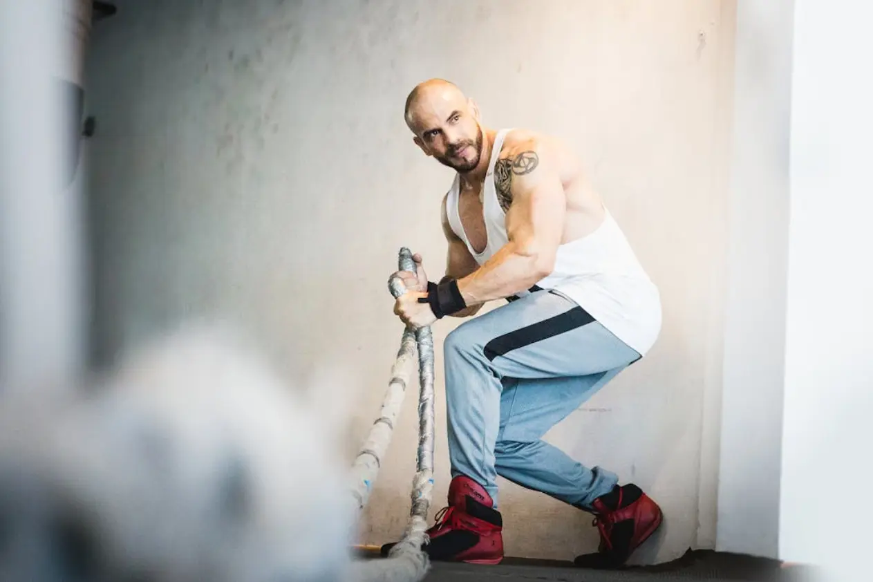 bearded man exercising with a rope